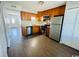 Well-lit kitchen featuring stainless steel appliances and wooden cabinetry at 1432 Highway 544 # B7, Conway, SC 29526