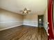 Inviting living room featuring attractive laminate flooring and neutral paint, bathed in natural light at 1432 Highway 544 # B7, Conway, SC 29526