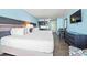 Cozy bedroom featuring two beds, a kitchenette, table and chairs and a TV at 1501 S Ocean Blvd. # 501, Myrtle Beach, SC 29577