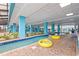 Indoor lazy river with bright blue pillars and brick-paved decking provides resort-style fun at 1501 S Ocean Blvd. # 501, Myrtle Beach, SC 29577