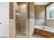 Bathroom featuring a glass shower, separate tub, decorative tile, and neutral walls at 1516 James Island Ave., North Myrtle Beach, SC 29582