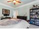 This bedroom features a large bed with dark wood furniture, decorated with posters and collectables at 1516 James Island Ave., North Myrtle Beach, SC 29582