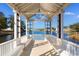 Scenic gazebo overlooking a tranquil lake with bench seating, and views of community homes at 1516 James Island Ave., North Myrtle Beach, SC 29582