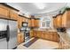 Well-equipped kitchen with custom cabinets, stone countertops, and stainless steel appliances at 1516 James Island Ave., North Myrtle Beach, SC 29582
