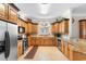 Spacious kitchen featuring stone countertops, custom wood cabinets, and stainless steel appliances at 1516 James Island Ave., North Myrtle Beach, SC 29582