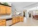 Bright kitchen with custom cabinetry and stone countertops, leading to the dining and living areas at 1516 James Island Ave., North Myrtle Beach, SC 29582