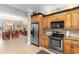 Kitchen with stainless steel appliances, custom cabinets, and a dining area visible through the opening at 1516 James Island Ave., North Myrtle Beach, SC 29582