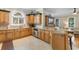 Open-concept kitchen with stone countertops, custom wood cabinetry, and stainless steel appliances at 1516 James Island Ave., North Myrtle Beach, SC 29582