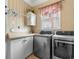 A modern laundry room equipped with high-end stainless steel washer and dryer for convenience at 1516 James Island Ave., North Myrtle Beach, SC 29582