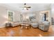Spacious living room featuring hardwood floors, a large sectional sofa, and a rustic coffee table at 1516 James Island Ave., North Myrtle Beach, SC 29582