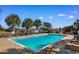 A sparkling community pool bordered by palm trees and lounge chairs offers an oasis at 1516 James Island Ave., North Myrtle Beach, SC 29582