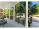 A covered porch with black metal railings offers a relaxing view of landscaped surroundings at 1516 James Island Ave., North Myrtle Beach, SC 29582