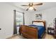 A comfortable bedroom features a wooden bed frame, a window, and a ceiling fan at 1622 Havens Dr., North Myrtle Beach, SC 29582