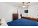 This comfortable bedroom features a ceiling fan, an egress to the dining area, and a wooden dresser at 1622 Havens Dr., North Myrtle Beach, SC 29582