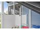 This outdoor shower features a rain style shower head, a hand held shower head, and a white privacy wall at 1622 Havens Dr., North Myrtle Beach, SC 29582