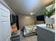 Bedroom with mounted TV, ceiling fan, side tables, drawers and plant, adorned with gray and white décor at 1659 Sw Beach Dr., Sunset Beach, NC 28468