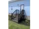 Charming front entrance with wooden stairs, black mulch landscaping and vibrant blue siding at 1659 Sw Beach Dr., Sunset Beach, NC 28468