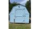 Light blue shed with black trim and a large 'G' in the center at 1659 Sw Beach Dr., Sunset Beach, NC 28468