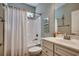 Cozy bathroom features a tub shower, white vanity, and neutral wall paint at 1903 Francis Ct., Myrtle Beach, SC 29577