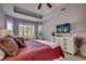 Well-lit bedroom features neutral carpet, a tray ceiling, and bright plantation shutters at 1903 Francis Ct., Myrtle Beach, SC 29577