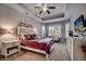 Spacious bedroom with tray ceiling, plantation shutters, and a cozy sitting area at 1903 Francis Ct., Myrtle Beach, SC 29577
