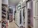 Well-organized walk-in closet features custom shelves and multiple hanging rods at 1903 Francis Ct., Myrtle Beach, SC 29577