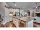 Open kitchen with granite island, stainless steel appliances, and views into the living room at 1903 Francis Ct., Myrtle Beach, SC 29577