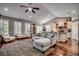 Open-concept living area with a kitchen, hardwood floors, and comfortable seating arrangement at 1903 Francis Ct., Myrtle Beach, SC 29577