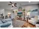 Comfortable living room featuring a ceiling fan, stylish decor, and a cozy rug on hardwood floors at 1903 Francis Ct., Myrtle Beach, SC 29577