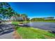 Scenic view of a serene pond surrounded by lush greenery and trees, next to walking path at 1903 Francis Ct., Myrtle Beach, SC 29577