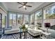 Bright sunroom featuring large windows, tile floors, and comfortable seating at 1903 Francis Ct., Myrtle Beach, SC 29577