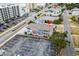 Aerial view of a multi-colored home with a large parking lot and street view at 2102 S Ocean Blvd. # D, North Myrtle Beach, SC 29582