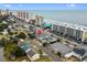 Aerial view of a multi-colored home close to the beach, street, parking and homes at 2102 S Ocean Blvd. # D, North Myrtle Beach, SC 29582