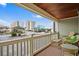 Balcony shows outdoor seating and views of parking lot with buildings in the distance at 2102 S Ocean Blvd. # D, North Myrtle Beach, SC 29582