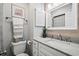 Bathroom features a white vanity, sink, toilet, and decor at 2102 S Ocean Blvd. # D, North Myrtle Beach, SC 29582