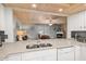 The kitchen features granite countertops, modern appliances, and ample counter space at 2102 S Ocean Blvd. # D, North Myrtle Beach, SC 29582