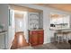 Cozy living room with built-in wet bar, hardwood floors, and access to the kitchen at 2102 S Ocean Blvd. # D, North Myrtle Beach, SC 29582