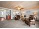 Cozy living room features a fireplace, wood ceiling, and natural light, ideal for relaxing at 2102 S Ocean Blvd. # D, North Myrtle Beach, SC 29582