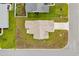 Aerial view showcasing the home's roof, driveway, and surrounding green landscape at 224 Fishburn Dr., Conway, SC 29526
