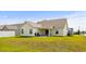 Well-maintained backyard featuring a covered patio and expansive green space at 224 Fishburn Dr., Conway, SC 29526