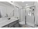 Well-lit bathroom featuring a glass shower door, gray vanity and modern fixtures at 224 Fishburn Dr., Conway, SC 29526