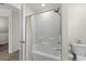 Clean white tub/shower combination with a neutral shower curtain and bronze fixtures at 224 Fishburn Dr., Conway, SC 29526