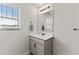 Well-lit bathroom with a modern vanity, mirror, and a window bringing in natural light at 224 Fishburn Dr., Conway, SC 29526