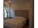 Bedroom with a large window, neutral-toned walls, and a plush bed, creating a serene and relaxing atmosphere at 224 Fishburn Dr., Conway, SC 29526