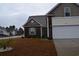Lovely home with a two-car garage, well-maintained landscaping, and an inviting front entrance at 224 Fishburn Dr., Conway, SC 29526