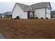Residential house highlighting an air conditioning unit, side window, manicured landscaping, and white vinyl siding at 224 Fishburn Dr., Conway, SC 29526