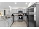 Bright kitchen with stainless steel appliances, granite countertops, and updated cabinetry at 224 Fishburn Dr., Conway, SC 29526