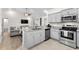 Updated kitchen with stainless steel appliances, granite countertops, and gray cabinetry at 224 Fishburn Dr., Conway, SC 29526