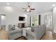 Inviting living room featuring comfortable seating, a ceiling fan, television, and access to the backyard at 224 Fishburn Dr., Conway, SC 29526