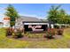 Signage for Red Hill Commons in a landscaped entrance with flowers at 224 Fishburn Dr., Conway, SC 29526